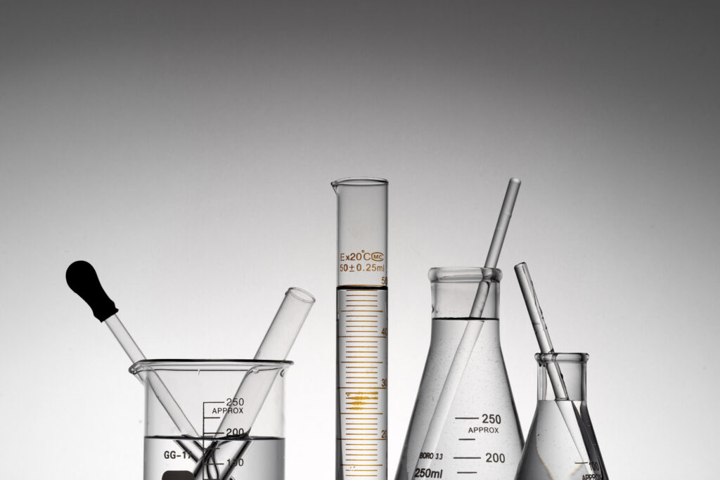 Closeup shot of transparent laboratory flasks, beakers, and tubes